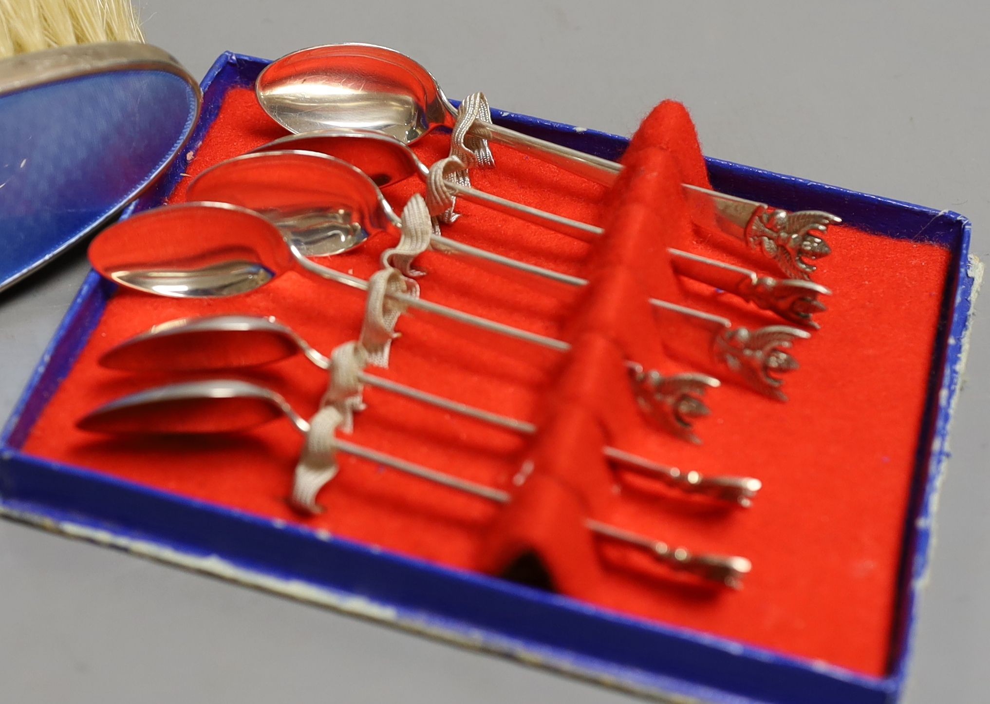 Two silver mounted glass scent bottles, a miniature Scottish silver vase, a five piece silver and guilloche enamelled dressing table set and a small group of assorted silver and sterling flatware